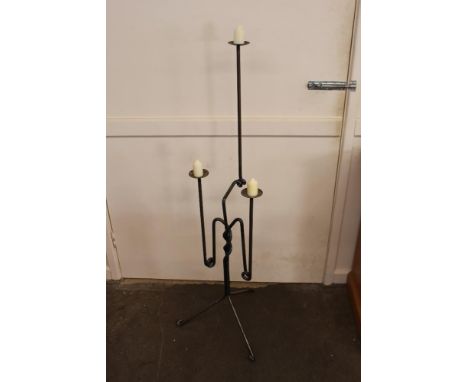 A decorative steel three light candle stand, 130cm high
