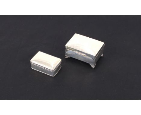 A small oblong silver trinket casket, Hallmarked for Birmingham date letter indistinct; and another similar