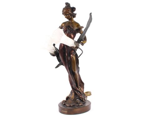 A bronzed Art Nouveau lamp, in the form of a maiden holding leaves, terminating in frosted glass flowerhead shades, "Roche", 