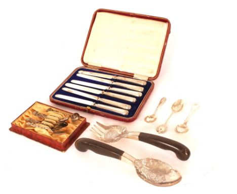 A cased set of six silver handled tea knives; a pair of oriental white metal and wooden handled servers; various other silver