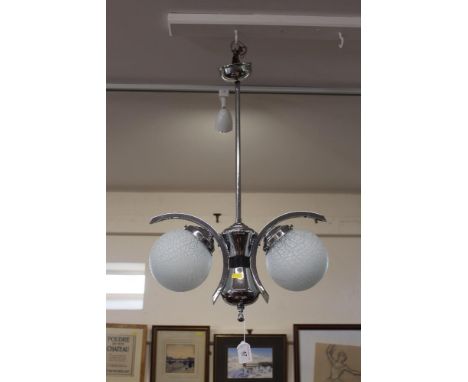 A chrome pendant ceiling light, fitted two frosted glass globular shades
