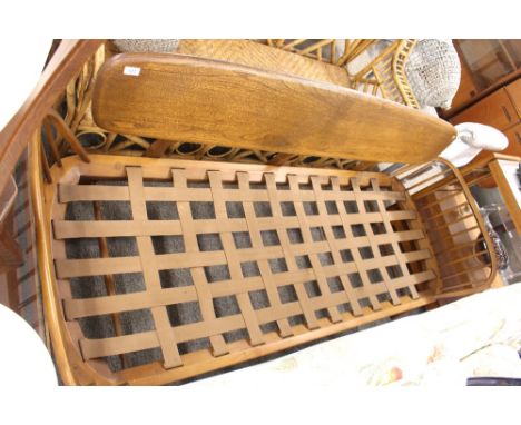 An Ercol settee with stick back sides,&nbsp;200cm long x 75cm deep