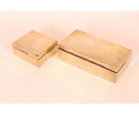 An oblong silver cigarette case, with presentation inscription; and a smaller similar