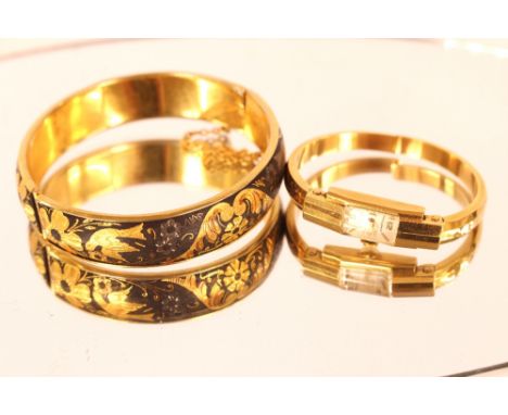 A yellow metal and niello ware snap bangle; and a ladies 18ct gold Golama wrist watch with snap bangle
