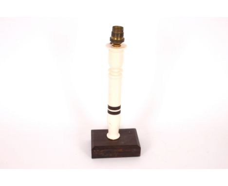 An Art Deco ivory and ebony candlestick table lamp, 31cm high overall