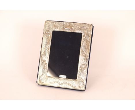 A small silver Art Nouveau style easel photograph frame, 19cm x 14cm