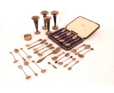 A cased set of six silver teaspoons; four silver trumpet shaped spill vases; and a collection of various silver and other spo