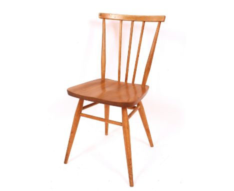A set of six light Ercol stick back dining chairs