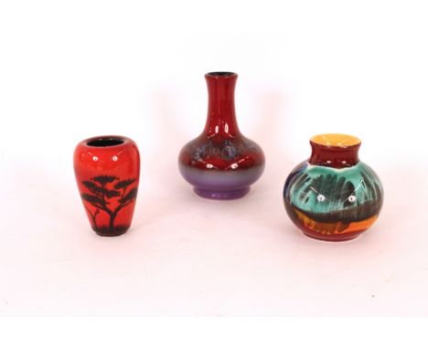 Three Poole pottery baluster vases