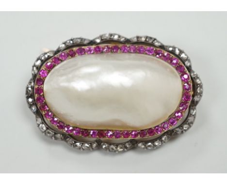 An early 20th century French yellow metal (18ct poincon mark on pin), white metal and mabe pearl set oval brooch, bordered by