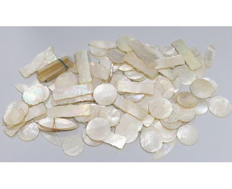 Approximately 135 Chinese carved mother of pearl counters of varying shapes, 19th century