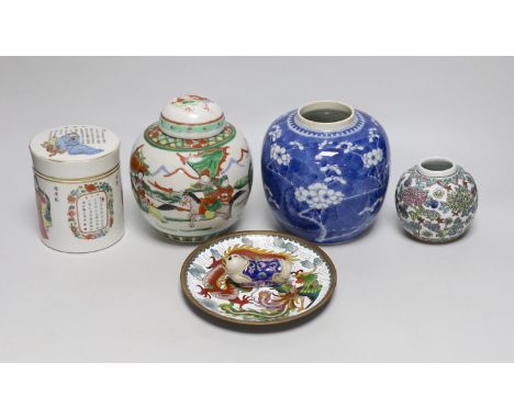A 19th century Chinese famille rose box and cover, a blue and white prunus jar, two other jars, a figural brush rest and a cl