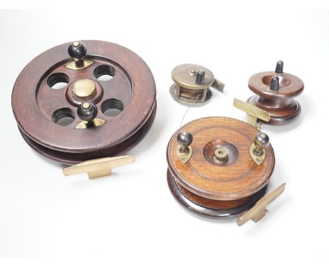 Three mahogany and brass fishing reels, largest 19 cm diameter and an Army &amp; Navy brass reel, 6.3cm diameter