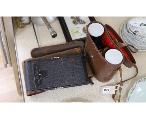 A Kodak camera and pair of binoculars