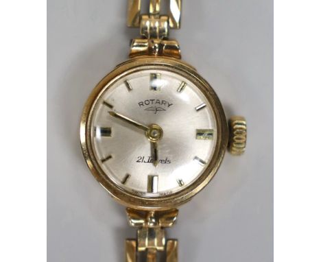 A lady's 9ct gold Rotary manual wind wrist watch, on associated 9ct gold bracelet, overall 17cm, gross weight 11.6 grams, wit