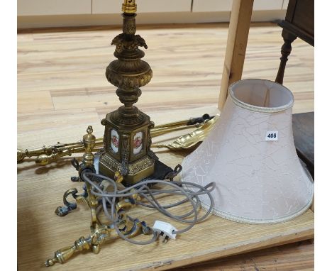 A brass table lamp and various fire implements