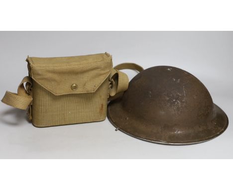 A British WWII military helmet and a pair of Kershaw military binoculars No. 326750