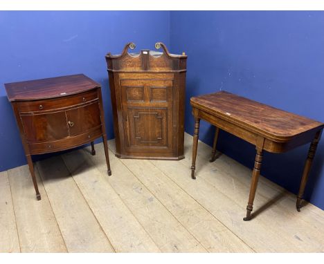 A William IV mahogany, cross banded fold over card table, the green baize faded and with wear, some splits to table and legs 