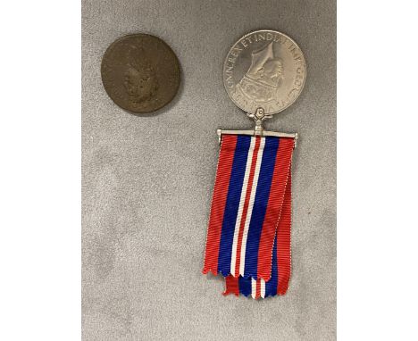 A WWII 1939-45 medal together with an antique worn copper coin, A red cased set of knife, fork spoon, and 2  x 1965 Churchill