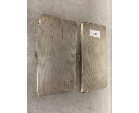 A near pair of sterling silver engine turned cigarette cases by Alfred Wigley Birmingham 