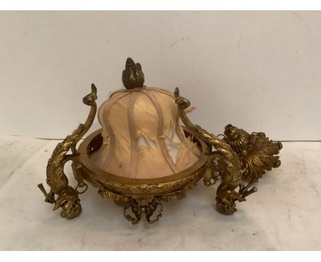 A gilt metal pendant light with three trumpet holding caryatid figures 