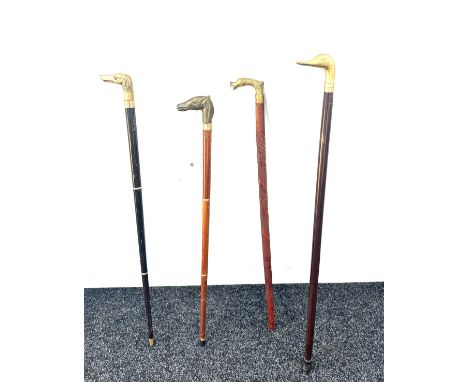 Selection of vintage wooden walking sticks with brass duck , dog, horse, fish head handles (4 in total) 