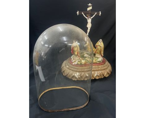 Glass dome religious ornament depicting the crucifix of Jesus, overall height 19 inches, Width 15 inches, depth 10 inches 