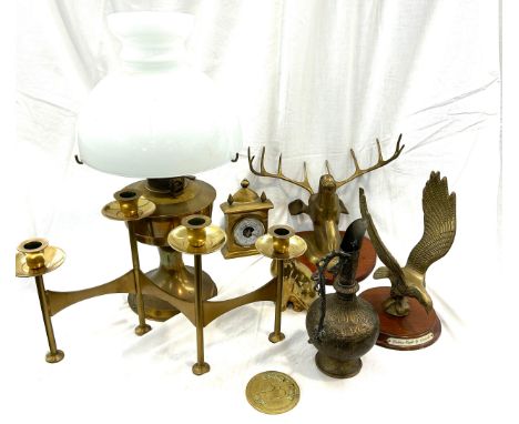 Selection of brassware to include candle stick holder, oil lamp, mantel clock etc 