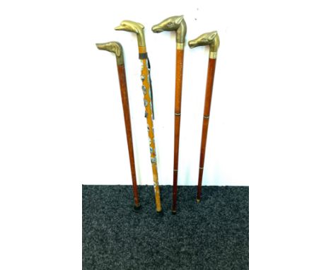Selection of vintage wooden walking sticks with brass handles includes horse, dog, dolphin etc 