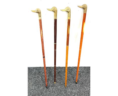 Selection of vintage wooden walking sticks with brass duck head handles (4 in total) 