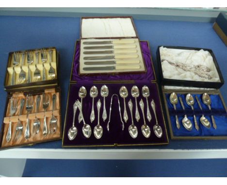 A selection of cased silver plated flatware, including two cased sets of six forks, a cased set of twelve tea spoons and suga