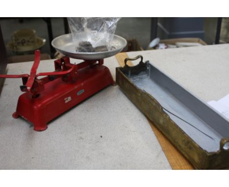 A Harper red painted metal scales, with weights, with a brass tray with handles