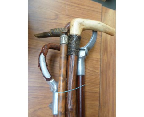 A 19th century antler handle walking stick, a hickory walking stick with carved dogs head, with two shooting sticks