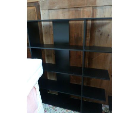 A black painted shelf unit, with four shelves with two dividers, 159cm W x 155H