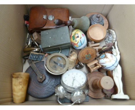 A mixed lot including many wooden items such as bowls, carved lidded pots, with a pewter cigarette box, an alarm clock, a vin