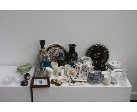 A mixed lot including a blue dimple glass poesey vase, various pieces of clear glass including a pair of candle sticks, a pai