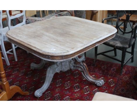 A 20thC oak pedestal table on four splayed legs and castors, 103cm x 113cm x 72cm high, with A set of six painted ladder back