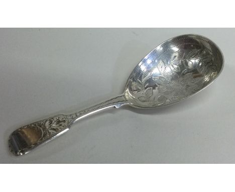 A Victorian silver caddy spoon with floral decoration. London. By EE. Approx. 15 grams. Est. £40 - £60.