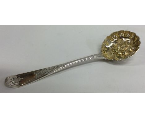A good quality Victorian cast silver berry ladle with gilded bowl. London. By GA. Approx. 63 grams. Est. £80 - £120.