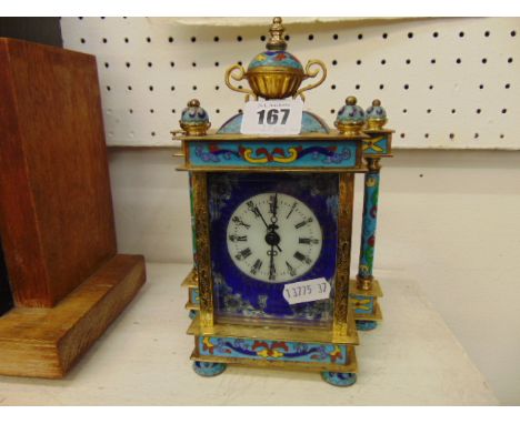 A brass and enamel mantle clock