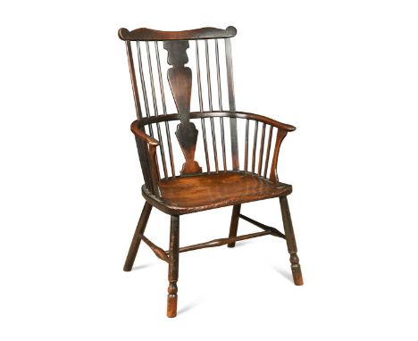 A Thames Valley ash, fruitwood and elm comb-back armchair, circa 1775, the vase shaped splat flanked by spindles over a mould