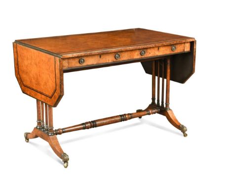 An early Victorian burr wood sofa table, the rectangular top with canted hinged flaps above two frieze drawers raised on turn