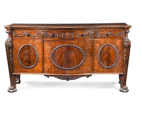 A Chippendale style mahogany commode, 20th century, the commode of serpentine form with gadrooned edge over Greek key mouldin