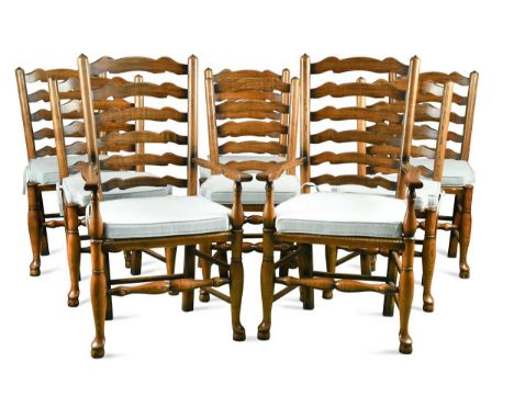 A set of eight George III style ladder back dining chairs, 20th century, to include two carvers, the rectangular wavy line la