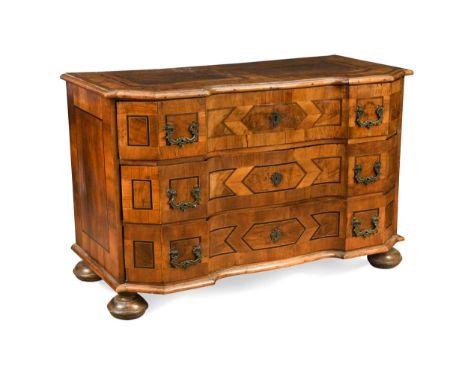 A South German/ North Italian parquetry commode, 18th century, of serpentine form with three long drawers raised on squat bun