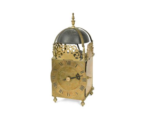 A brass lantern clock in 17th century style, 19th century, of typical design with bell top above arcaded frets, engraved dial