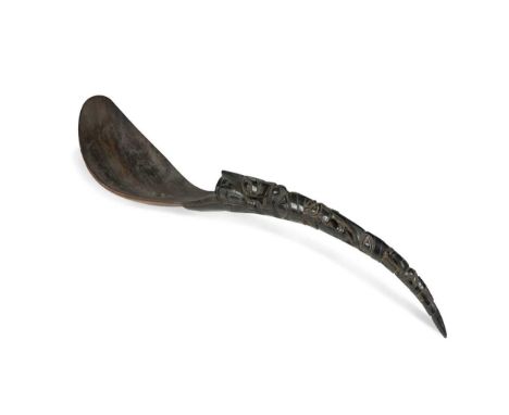 A Tlingit horn ladle, North West Coast of America, 19th century, the pierced curved handle carved with Totem masks31.5cm