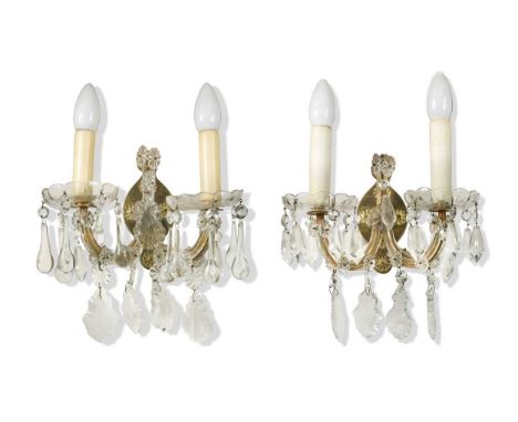 A group of seven glass wall sconces, 20th century, decorated with moulded flower heads and drop pendants32 x 30cmtogether wit