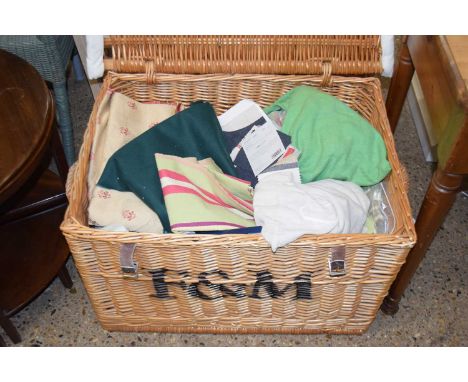 A Fortnum &amp; Mason wicker hamper containing various material offcuts