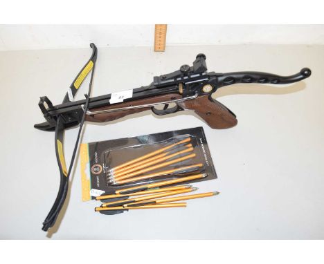 A small crossbow model number CR-039W4 together with arrows